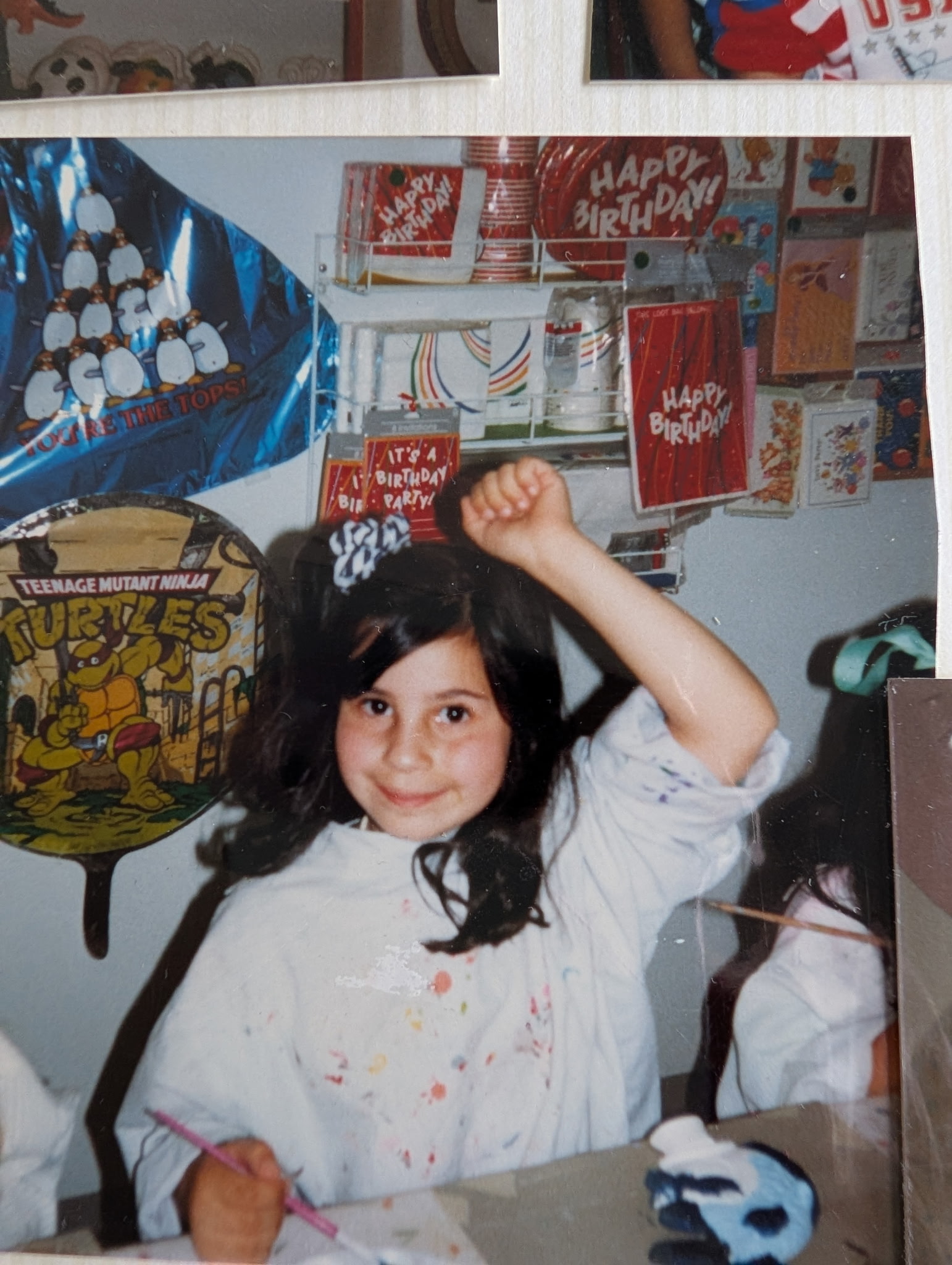 Cris as a kid at a birthday party