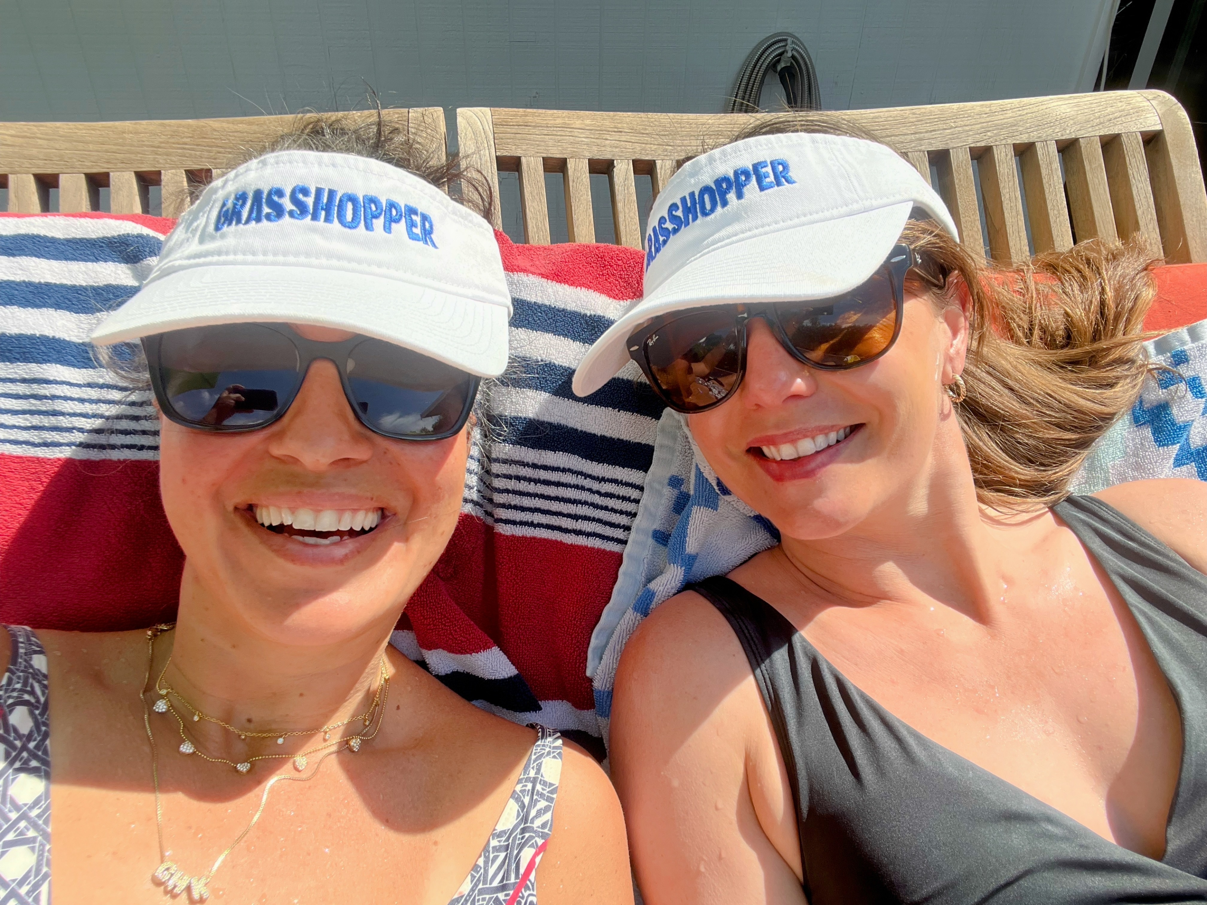 Cris and Arielle in Grasshopper visors by the pool
